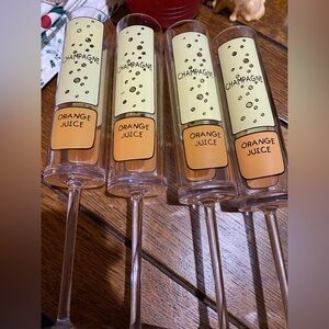 Champagne Flutes made in Plastic with design of how much juice and wine goes on